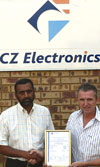 Directors Sagran Pillay (CEO – left) and Rob Bruggeman (COO) show off CZ Electronics’ Level 3 BBBEE certificate